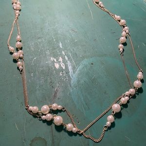 Long strand of costume jewelry pearls